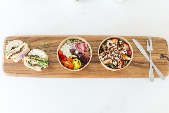 Taco and salad board on a wood plank
